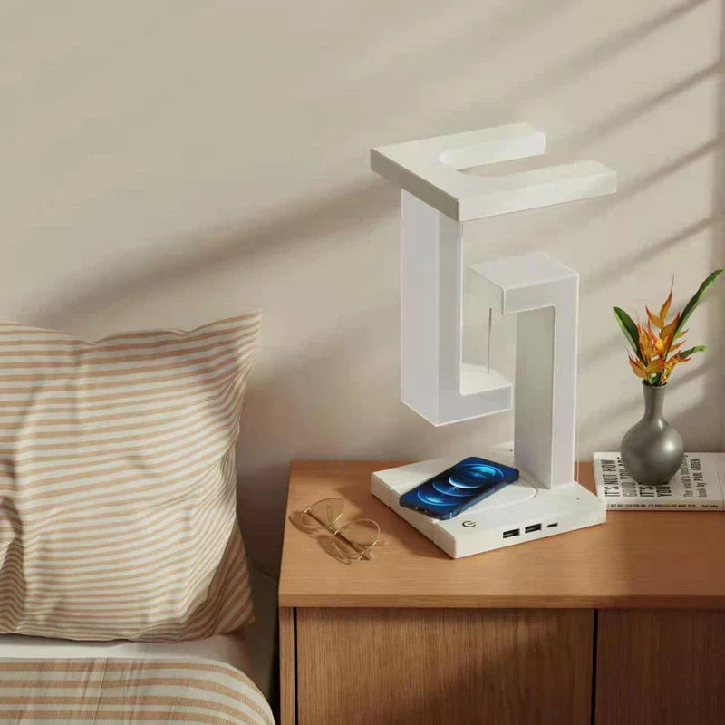 LED table lamp with wireless charging, featuring a modern floating design, on a bedside table.