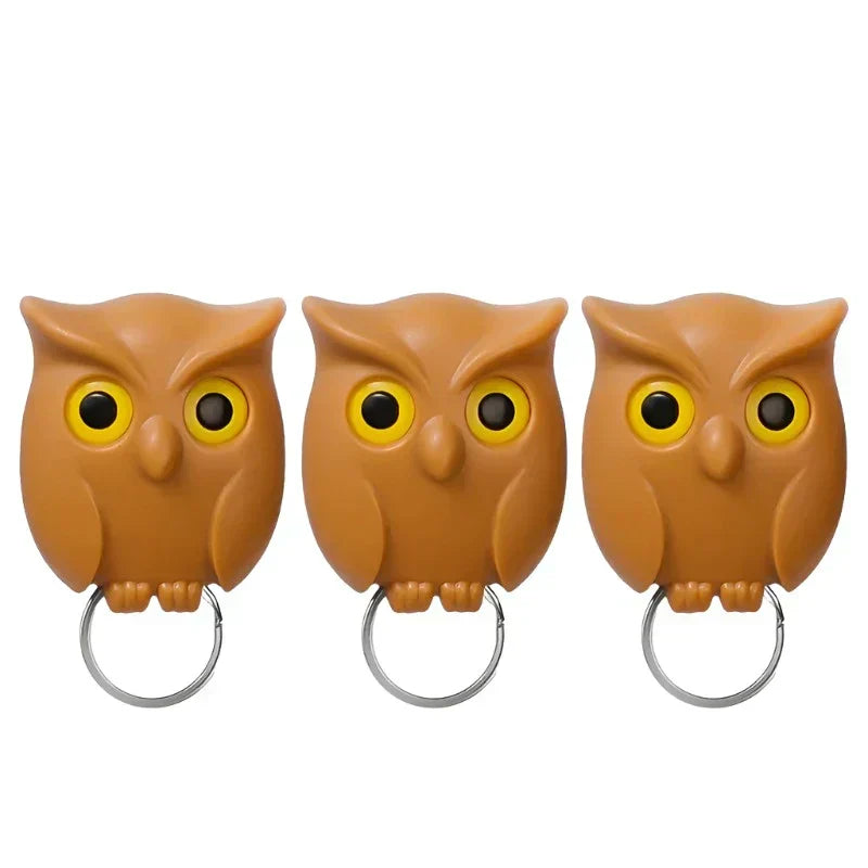 Set of three owl magnetic key holders with key rings, featuring a cute design and eye-opening mechanism, made of durable ABS material.