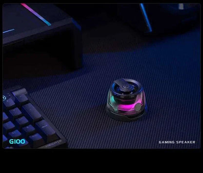 Magnetic wireless Bluetooth gaming speaker with colorful lights on a desk.