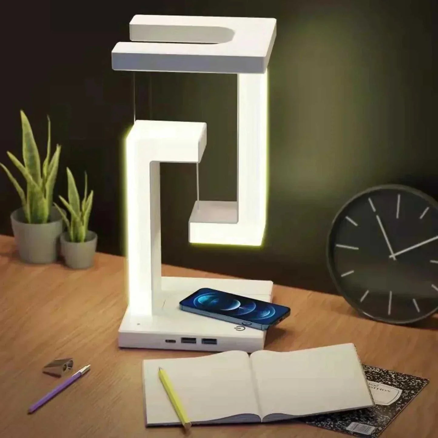 LED desk lamp with wireless charging, featuring a floating design, adjustable lighting, and touch control; combines innovation and style for home or office.