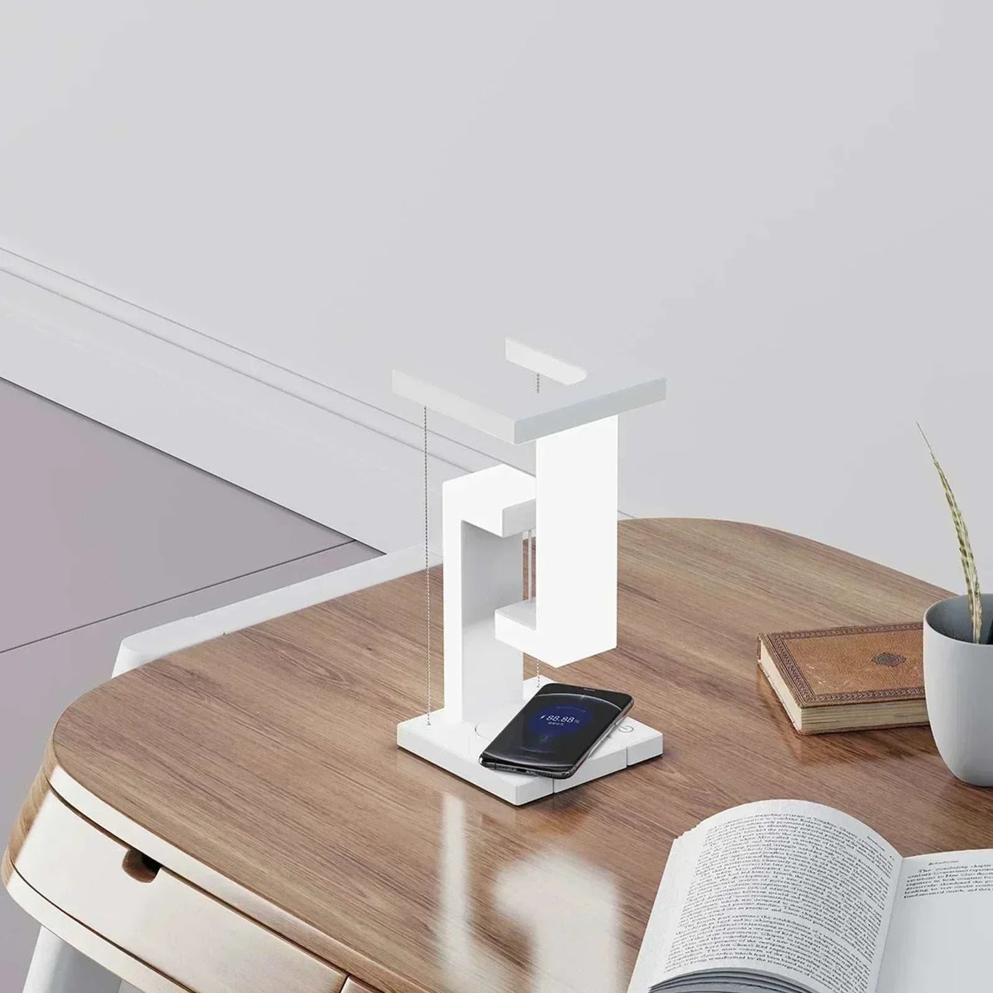 Table with LED lamp featuring mobile phone wireless charging function, modern design, and touch control, placed on a wooden surface.