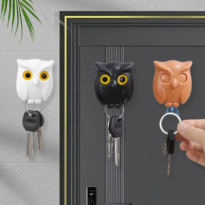 Owl magnetic keys holder in black, white, and coffee colors holding keys on a wall.