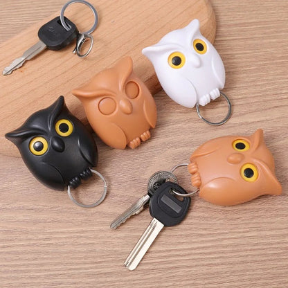 Owl magnetic key holders in black, white, and coffee colors with keys attached.