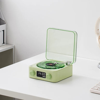 Green Waves Bluetooth Vintage Player on a white desk with digital display showing time.