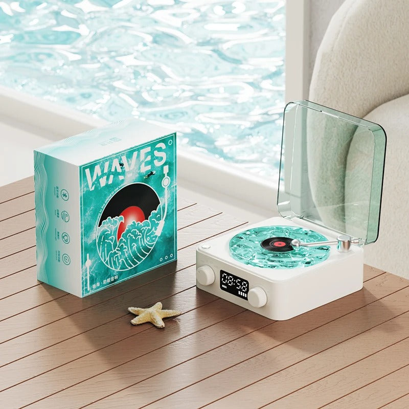 Bluetooth vintage-style player with turquoise wave design, featuring a transparent cover and packaging, on a wooden table.